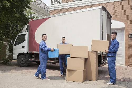 Van loading recyclable household items for sustainable removal in Uxbridge