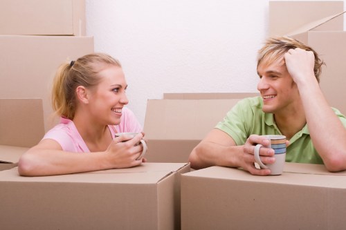 Packed household boxes and furniture ready for removal in Uxbridge
