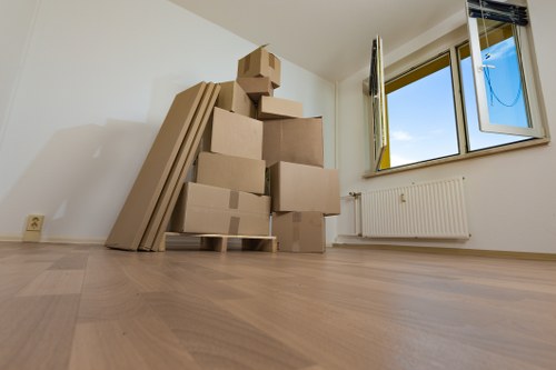 Local movers loading boxes for a Uxbridge business relocation