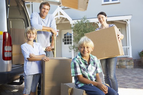 Professional movers handling household items in a Uxbridge property
