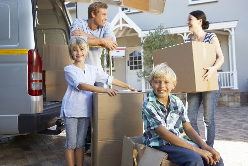 Boxes and furniture being loaded into a removal van