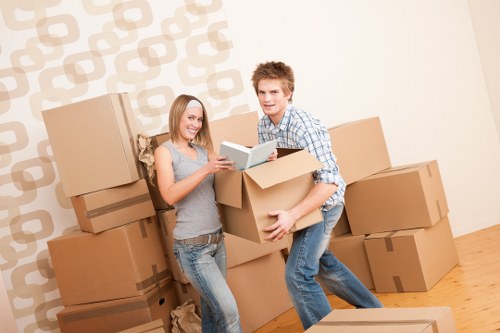 Packed boxes and furniture ready for collection by a local removals company
